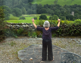 Liz practising Chi Kung in the Lake District