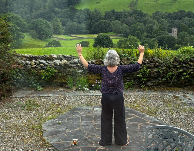 Liz practising Chi Kung in the Lake District